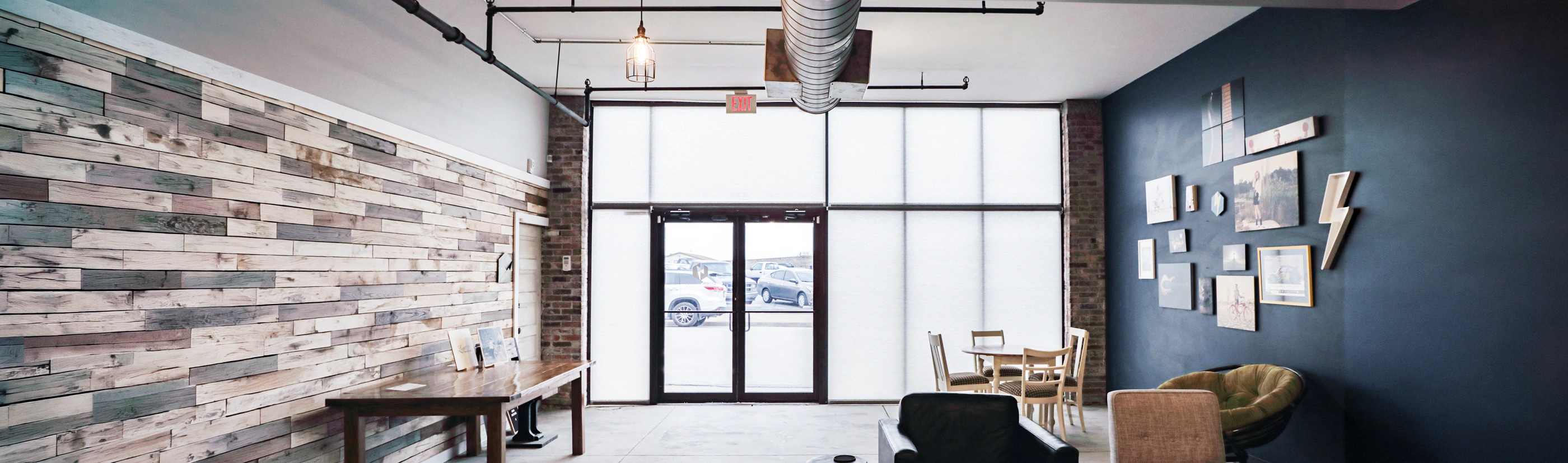 white roller shades from ceiling to floor in a business lobby