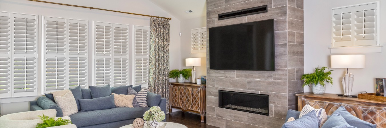 Interior shutters in Bay Village living room with fireplace