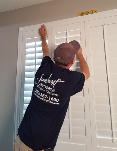 Shutter installation in Cleveland bedroom.