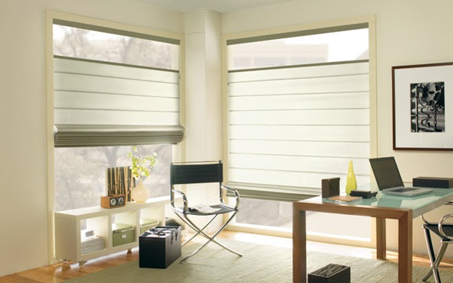 Upgrade your windows with stylish window shades or shutters in Cleveland. Stylish sheer shades in the corner of a modern office.
