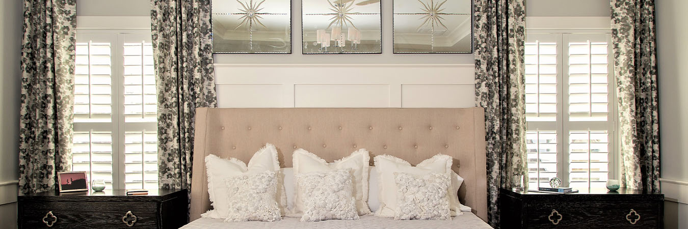 Plantation shutters in a bedroom