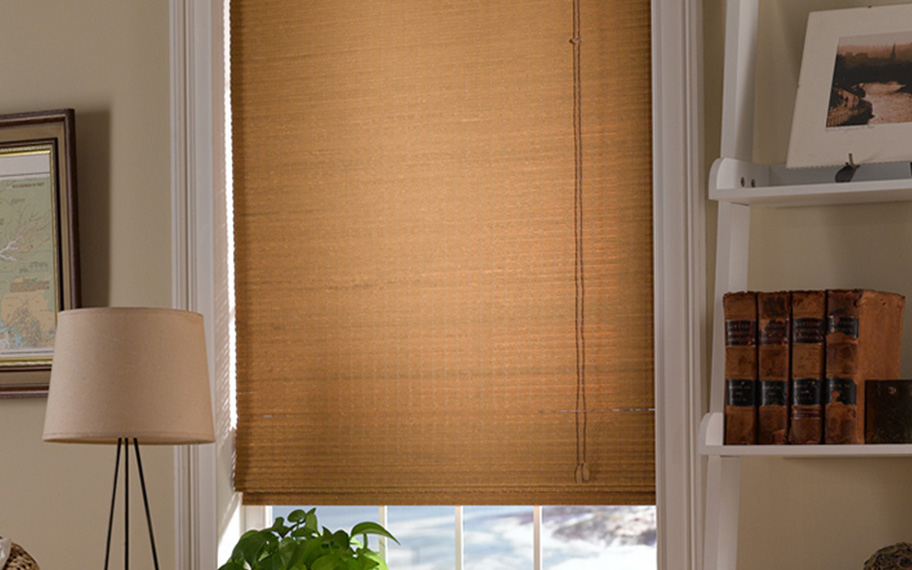Add a touch of nature to your decor with woven fiber shades in Cleveland. Tan woven fiber shades in a living room