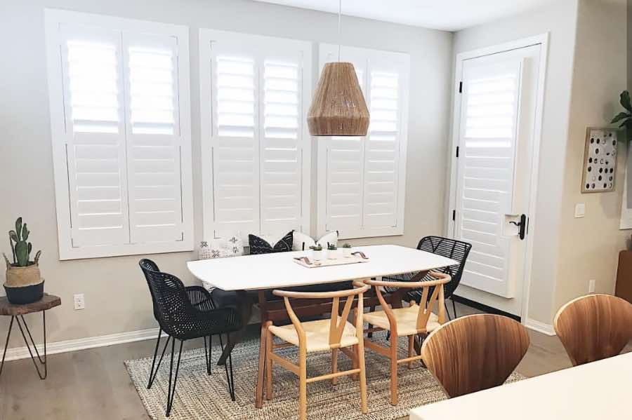 Use Polywood shutters to control natural light levels in your Cleveland dining room. Polywood shutters with top louvers tilted open in a dining room