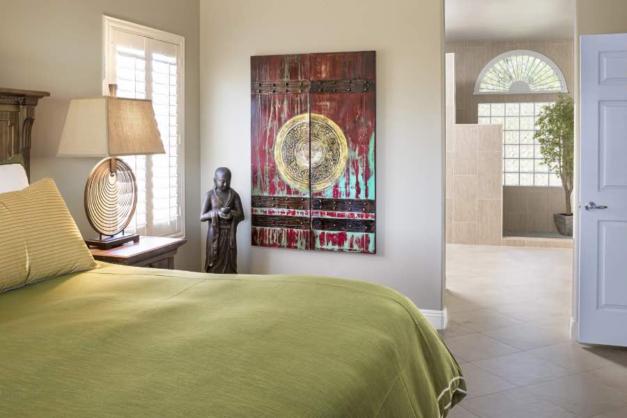If you're tired of beige walls, add bright artwork for exciting visual interest. A colorful piece of art on a beige bedroom wall