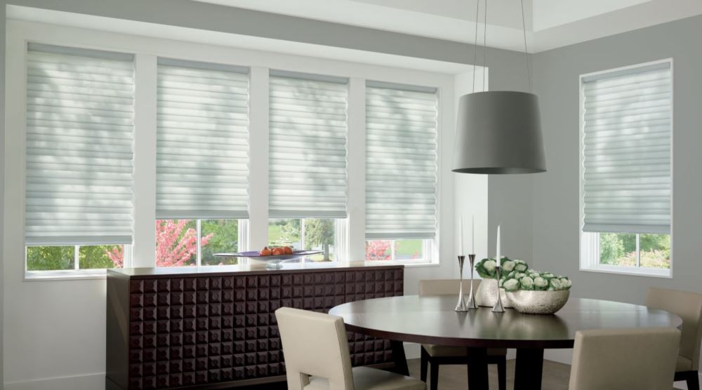 Custom cordless roller shades have a clean look and are appropriate for any room. Cordless motorized shades in a Cleveland dining room