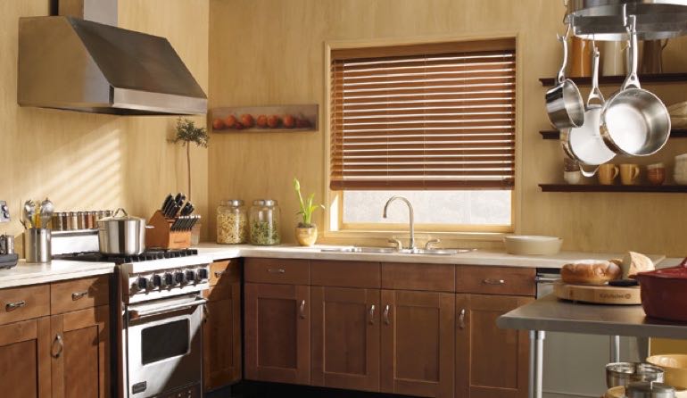 Faux wood blinds look beautiful in Cleveland kitchens. Cleveland kitchen faux wood blinds.