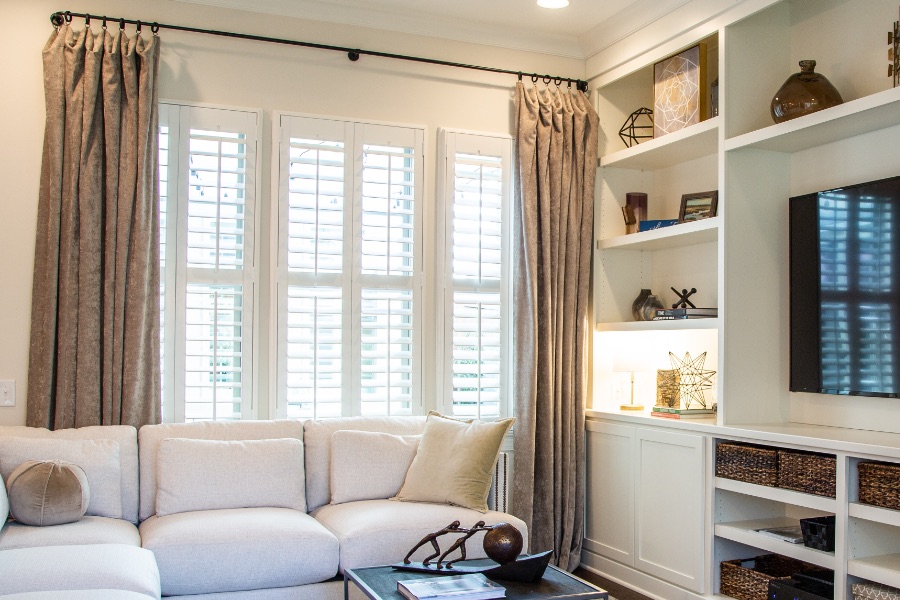 Install sun-resistant Polywood shutters in Cleveland. Shutters in a living room
