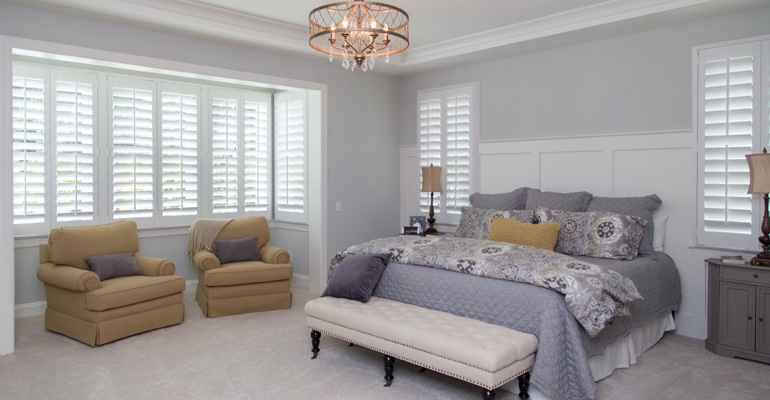 interior shutters offer subtle beauty. Plantation shutters in Cleveland bedroom.