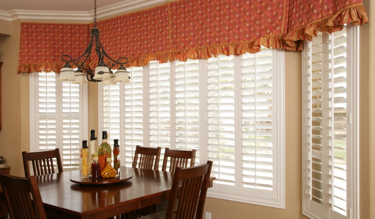 Decorative accents, drapes, and curtains may not reflect the simplicity you are going for. White shutters in Cleveland dining room.