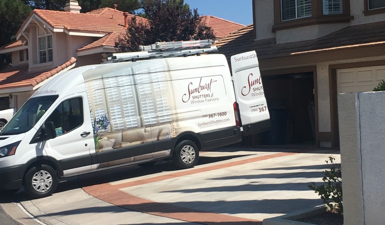 With an in-home consultation, we bring the showroom to your room. Alt text: Sunburst Shutters van at customer's home.