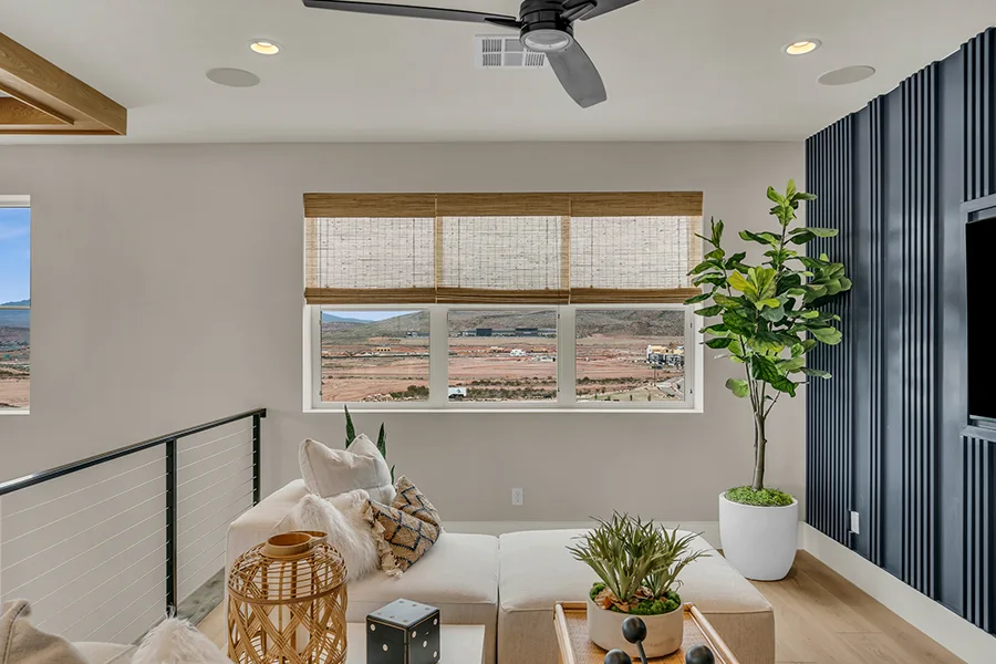 Cleveland homeowners who want eco-friendly home fixtures should consider natural woven shades. Natural brown woven shades on a window in a stylish sitting area