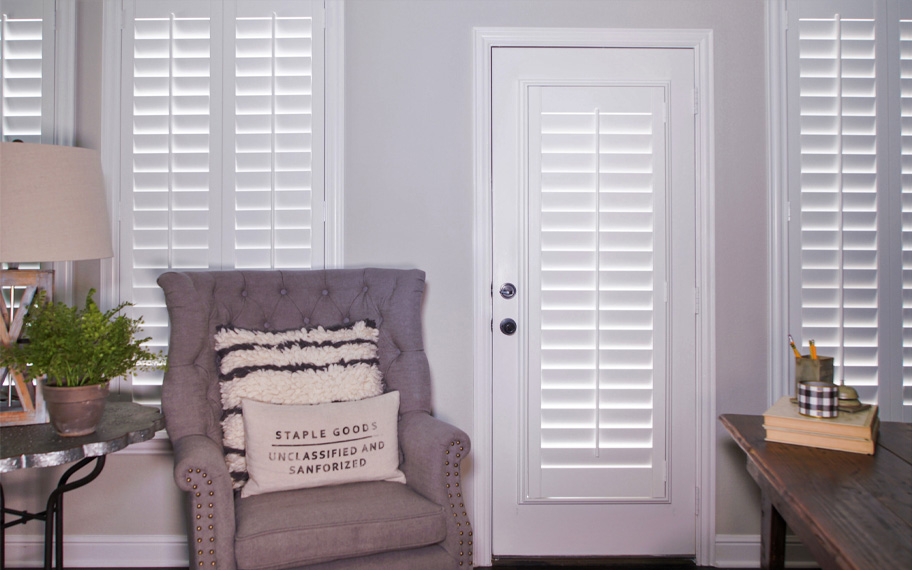 Interior shutters are beautiful and durable window treatments for glass doors in Cleveland. Polywood shutters on a door