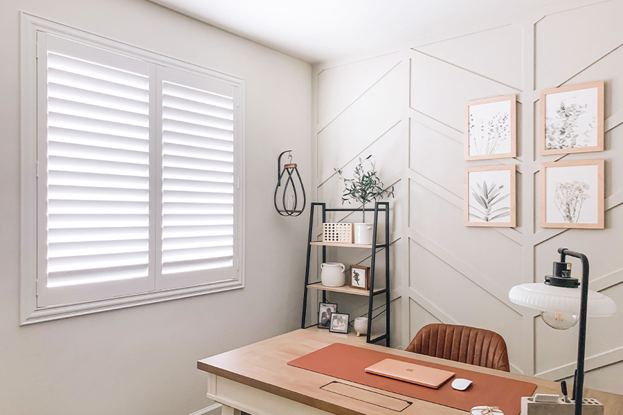Polywood shutters give you maximum control over natural light in your Cleveland home. Photo Credit: @OurLakepoint Farmhouse  White and off-white farmhouse style office with natural light from polywood shutters.